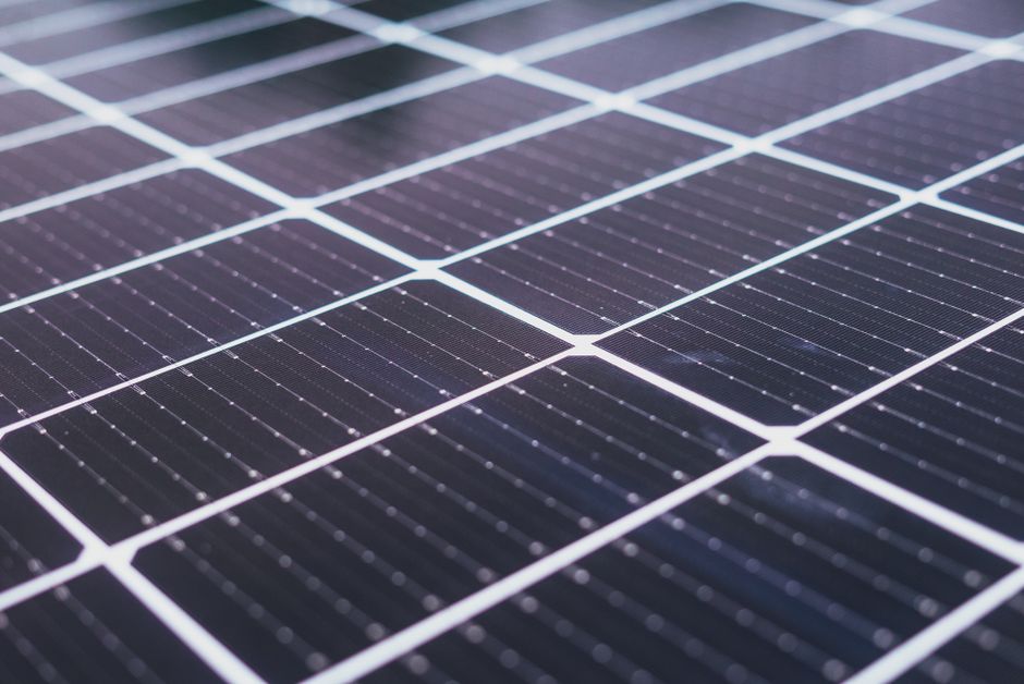 Close-up of a solar panel's photovoltaic cells catching sunlight